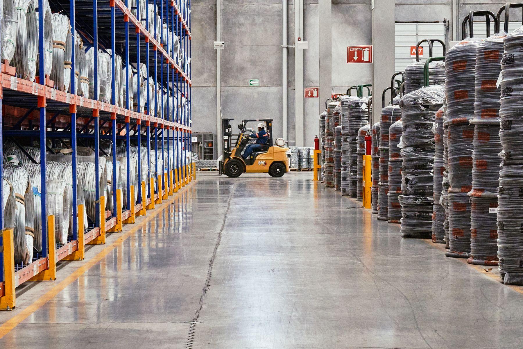 Modern warehouse aisle with forklift